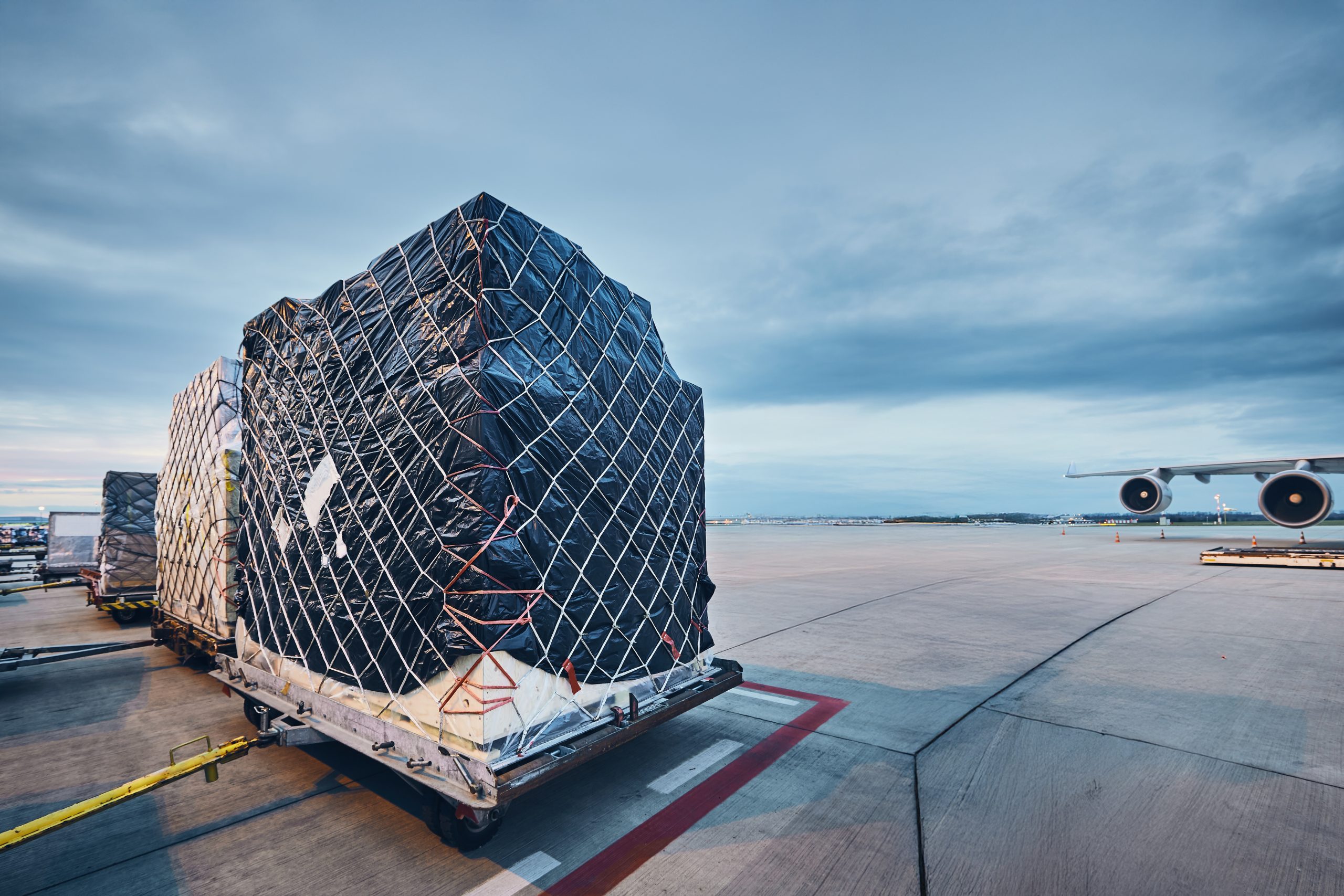 Loading cargo to airplane plainbg-1-scaled